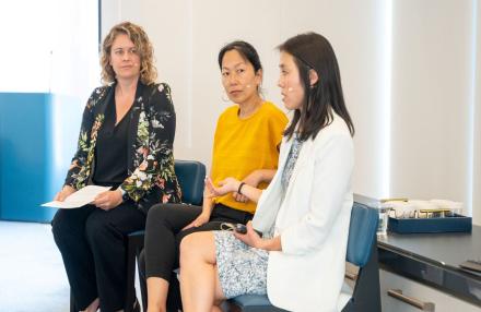 Three women speaking on a panel